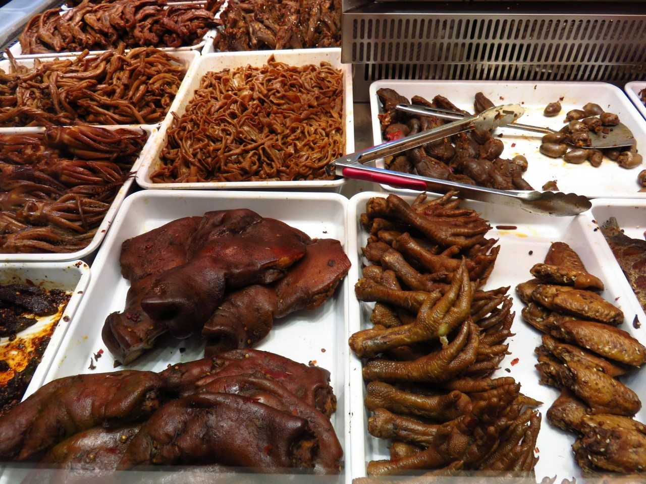 some food in China - chicken feet and pig face