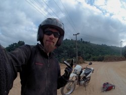 Stevie on the motorbike through Laos