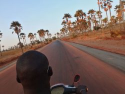 hitchhiking a scooter in senegal